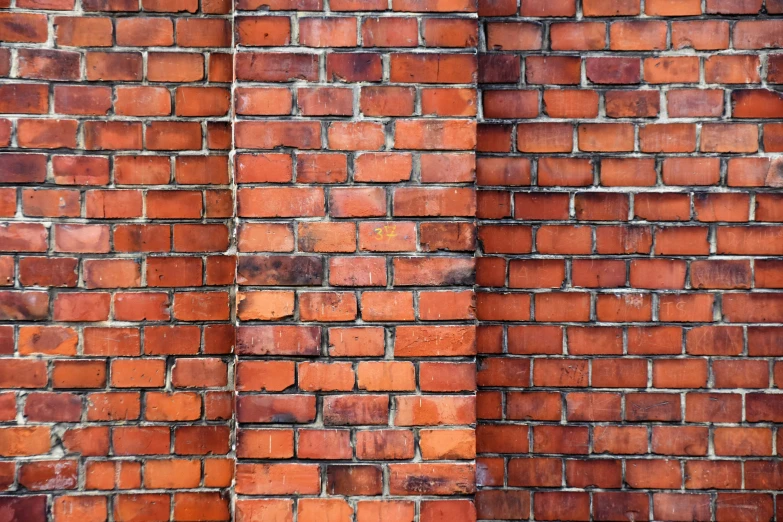 two bricks have been taken apart to show the brown paint