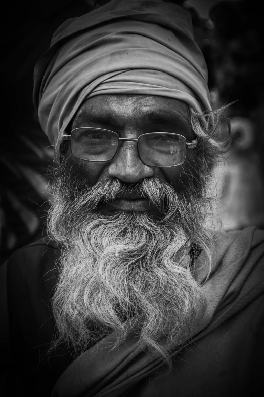 an old black and white po of a man with a long beard