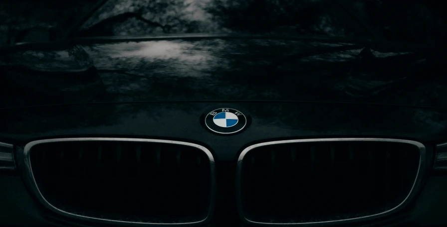 a bmw logo is seen on the front of a car