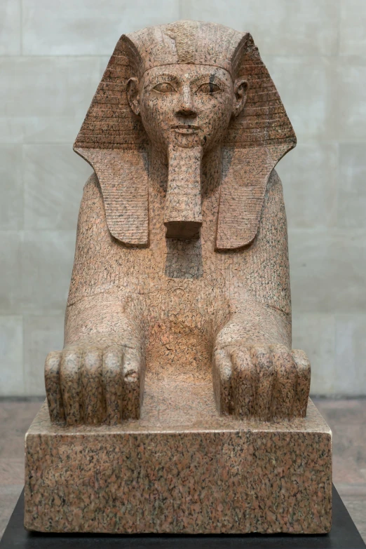 a statue of an egyptian sphinx on display