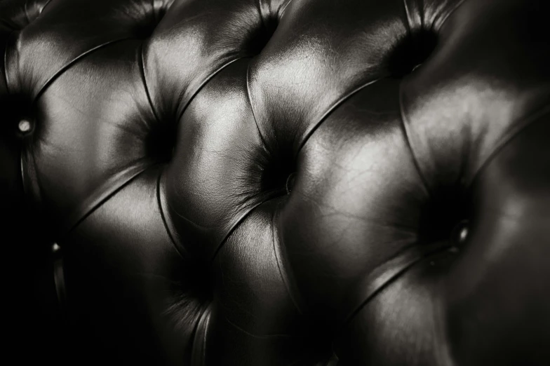 a close up po of the black leather seat