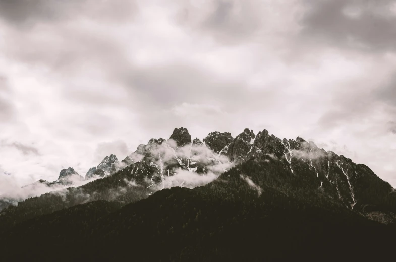 some very pretty mountain tops that are in the clouds