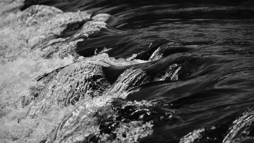 black and white po of waves on the water