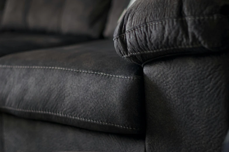 a black couch with no pillows on it