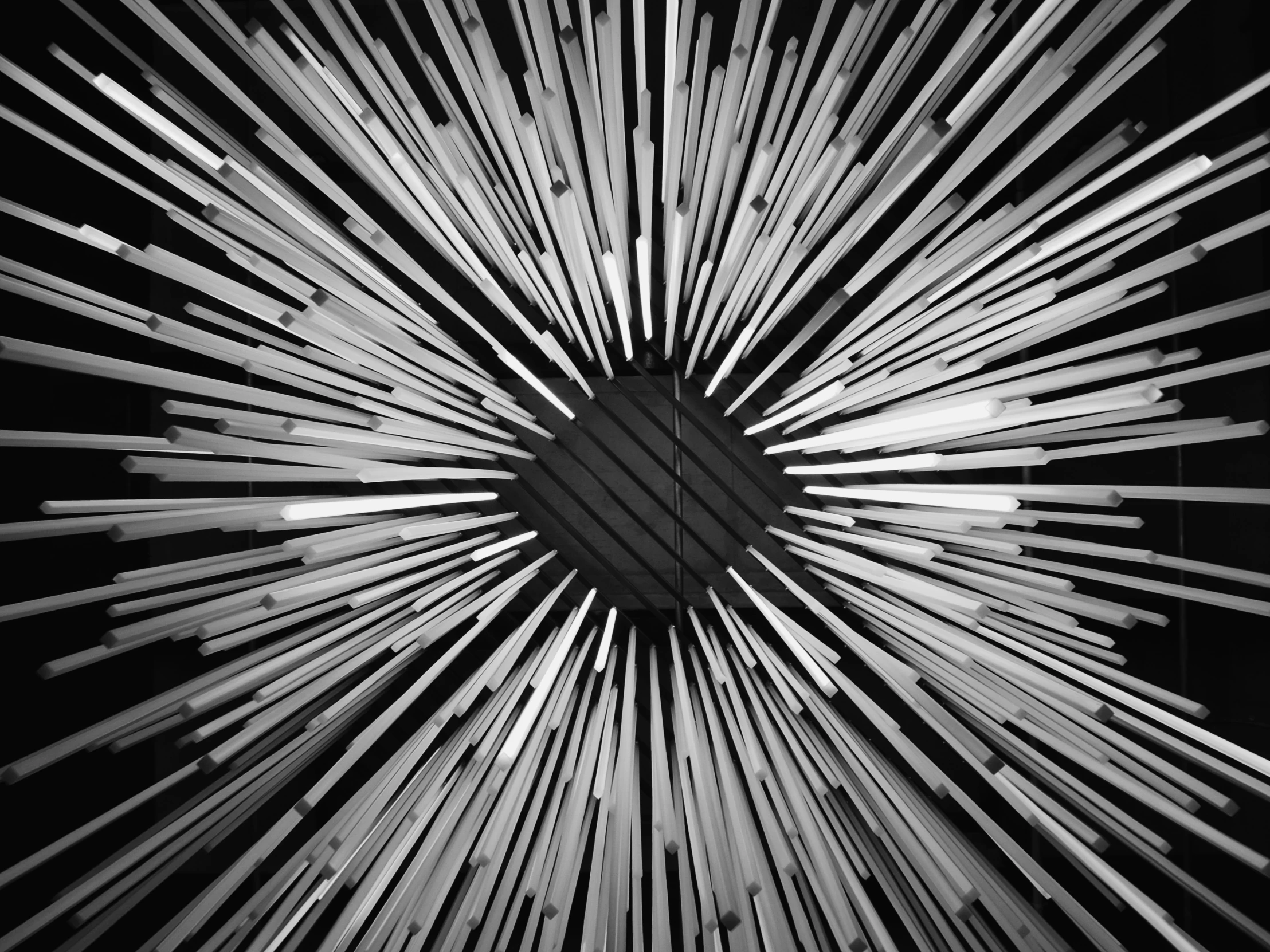 a starburst image taken in the dark with a black and white background