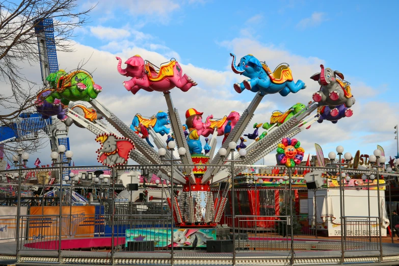 large colorful carnival rides with floats and other rides