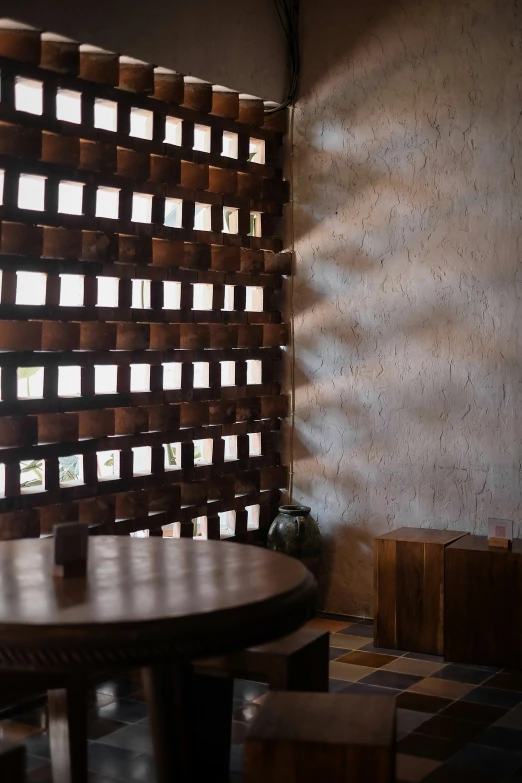 a wooden table in front of a wooden sculpture