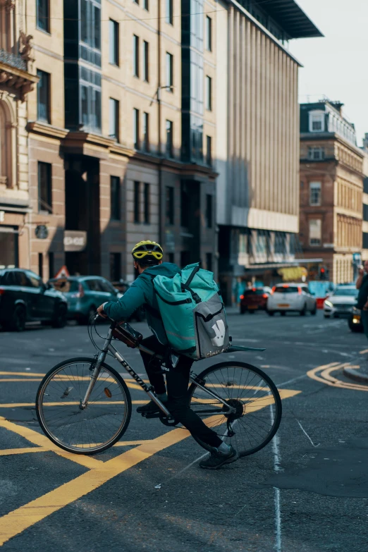 a person riding a bicycle through a street