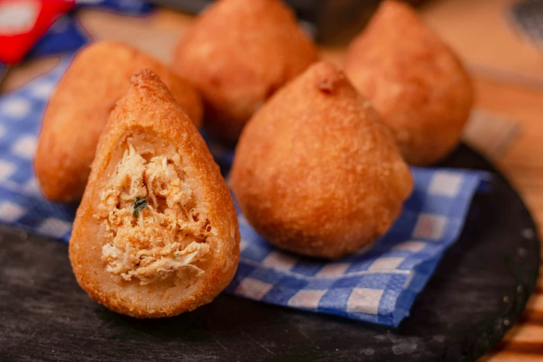 a close up of four baked items on a plate