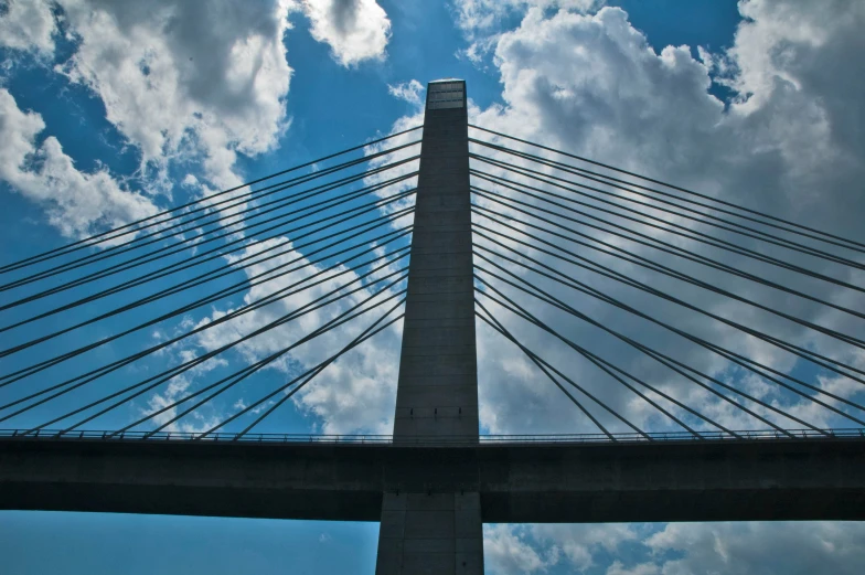 the large bridge is in view over a lake