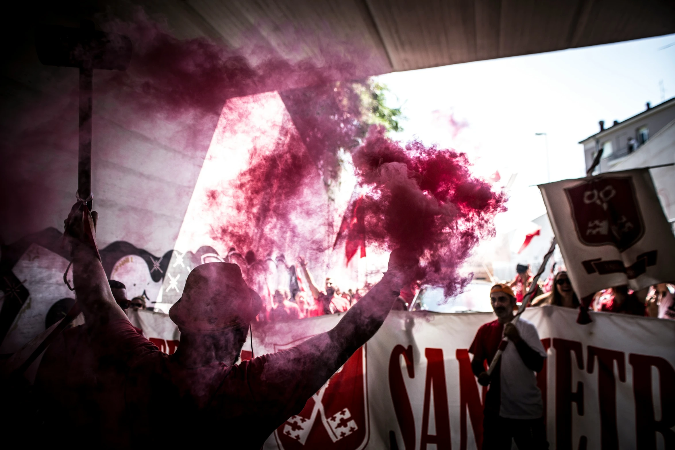 a man is holding up his hands with smoke coming from them