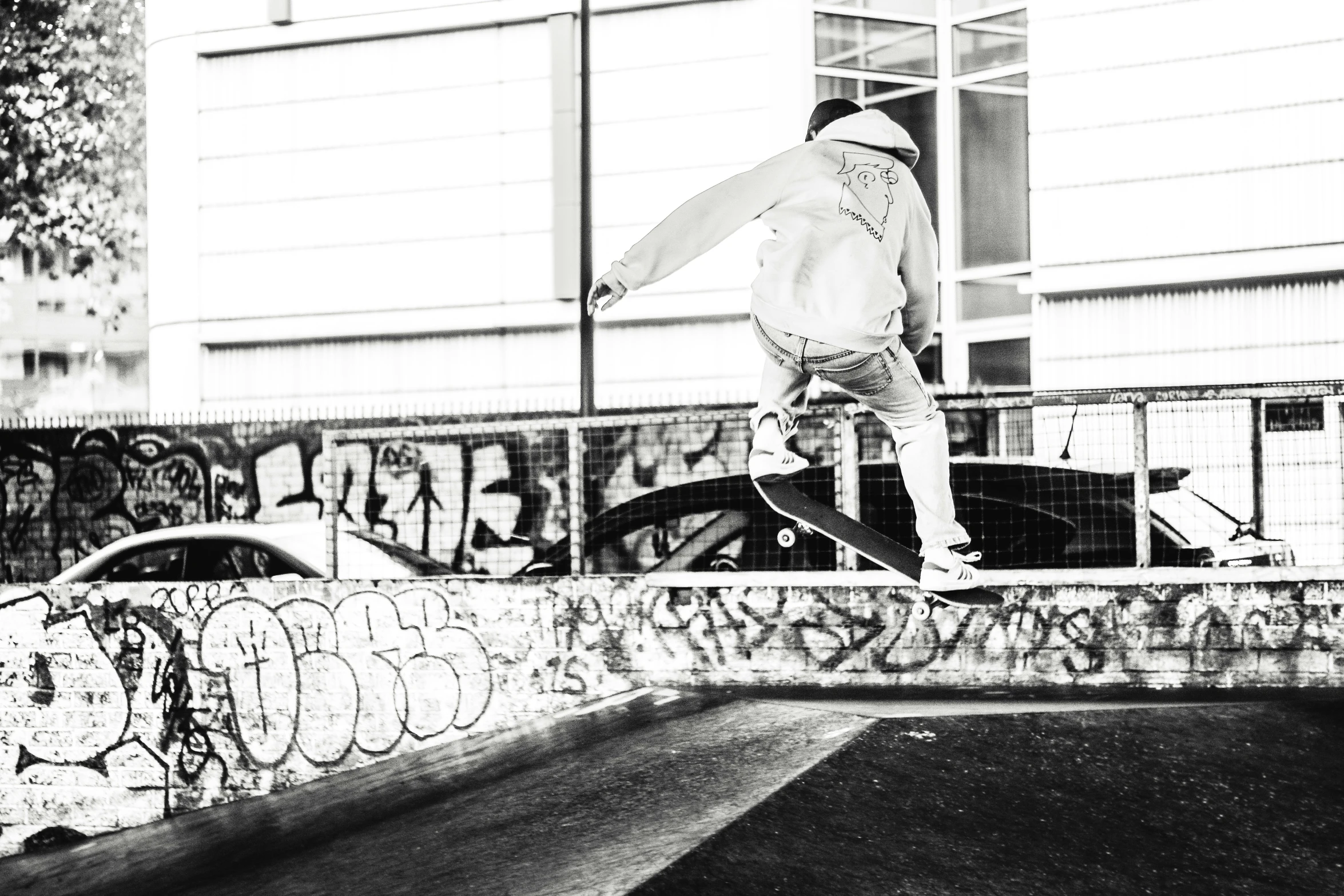 a skateboarder is in mid - air doing a trick