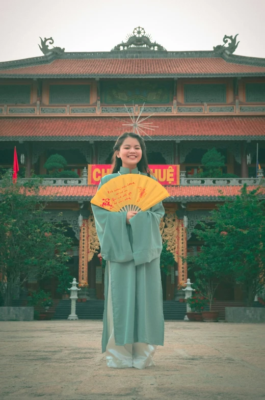 the woman is standing outside in front of a building