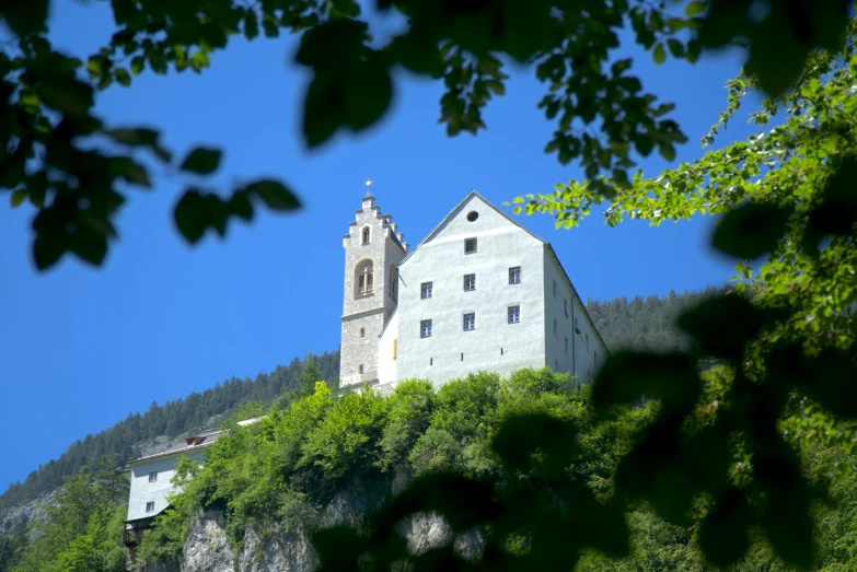 a view of a church from behind the trees