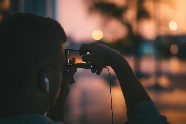 a person taking a po of the street with their cell phone