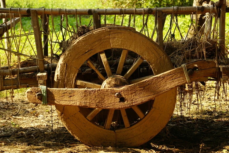 a wagon with an old wheel attached to it