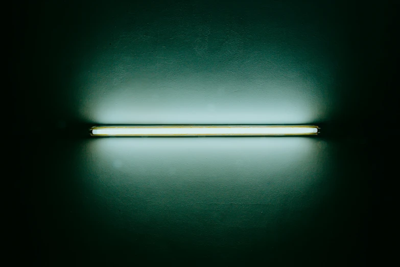 an open rectangular object that is lit up in the dark