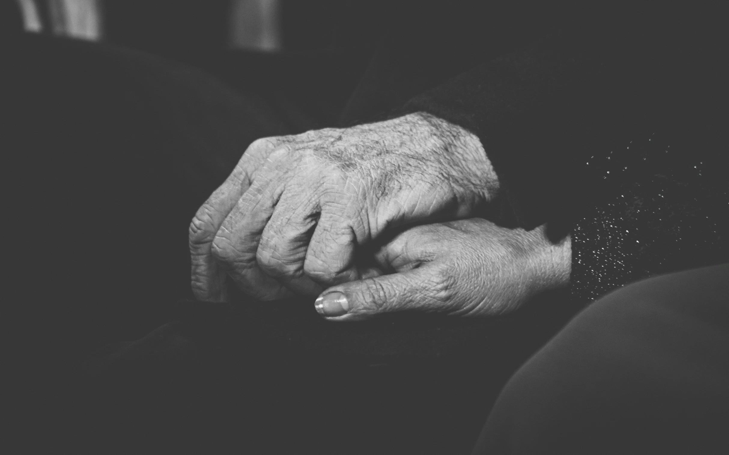 a pair of hands that are in the middle of a persons hand