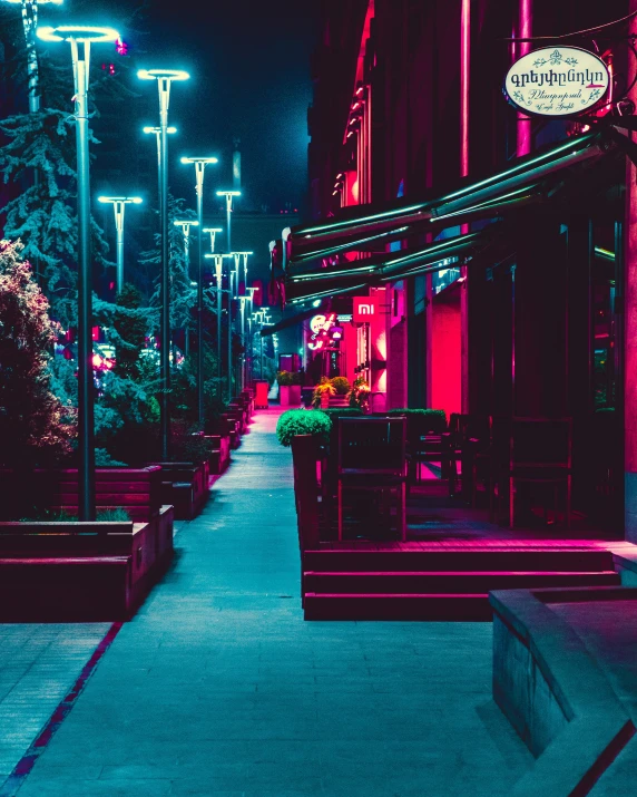 an alley way with red lights is lit up