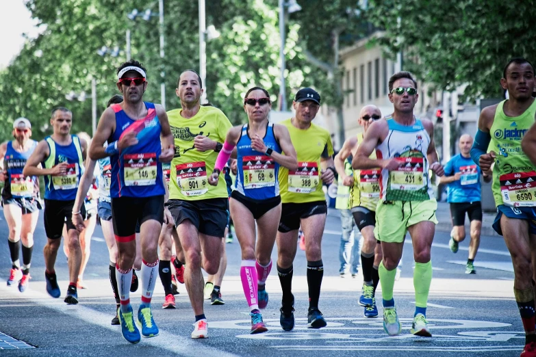 a group of runners running in a marathon