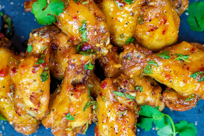 this is a plate of food with chicken wings