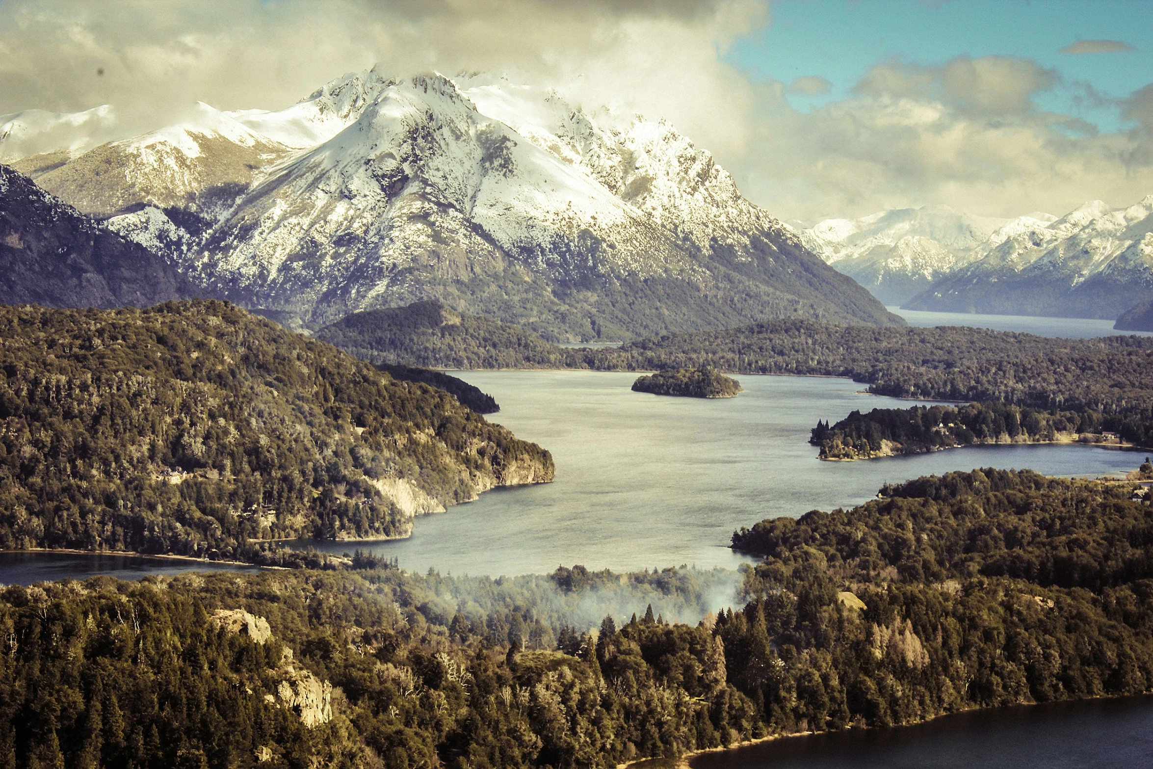 view of a large mountain with a lake near it