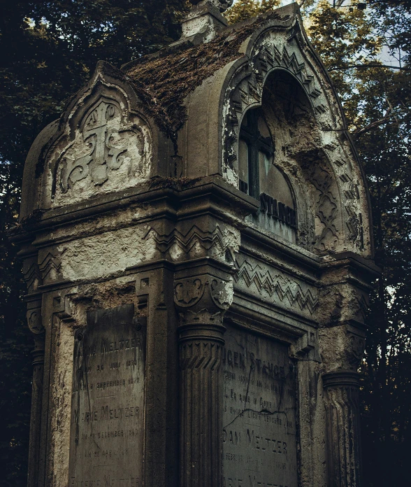 the remains of a monument sit in a park