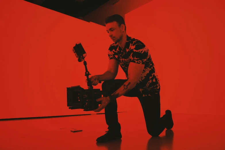 the pographer prepares his po in an indoor studio