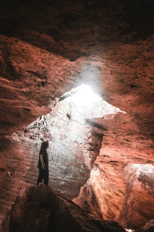 a person standing alone in the middle of the desert