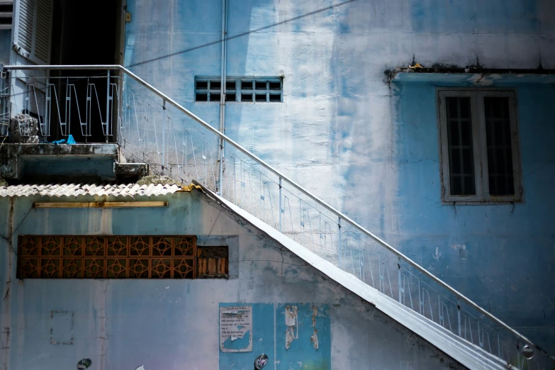 the stairs lead up to the top floor of an empty building