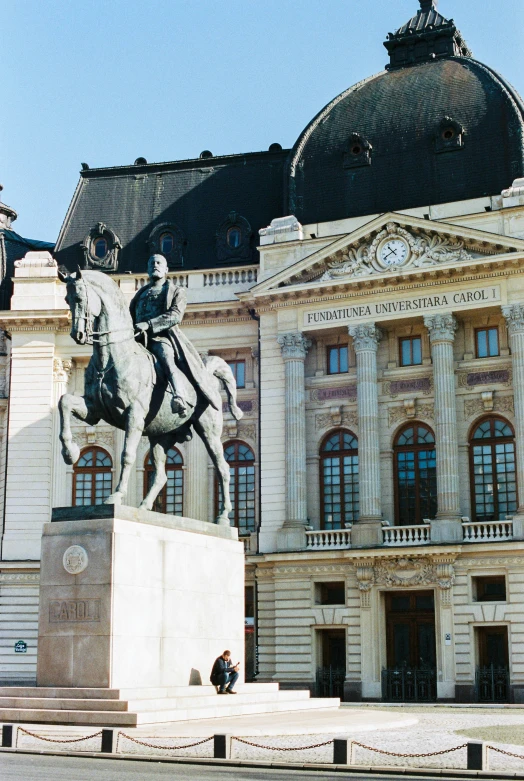 a statue of a man on a horse sitting outside