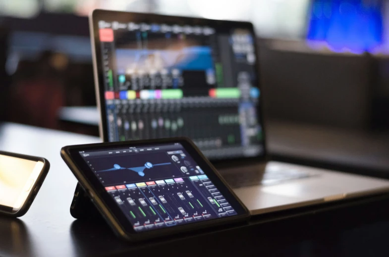 two laptops side by side on a table