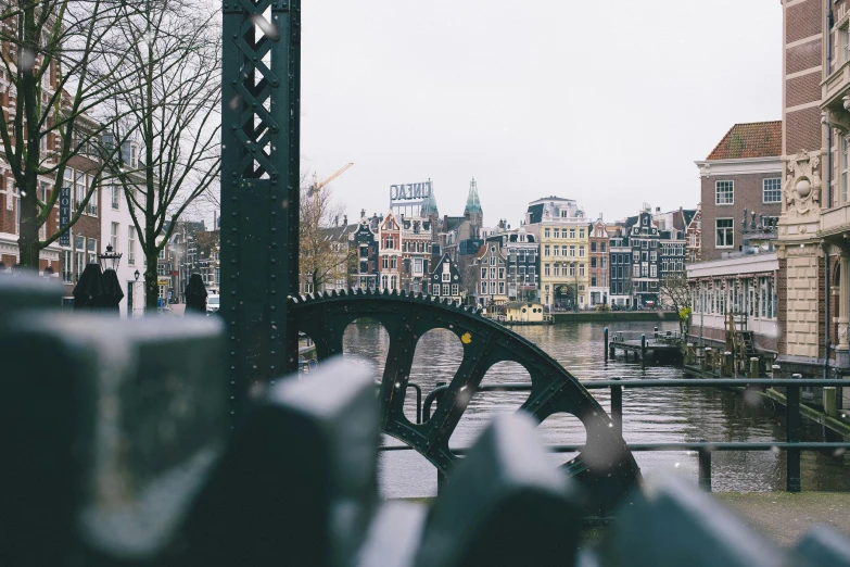 a bridge that goes over a river in a city