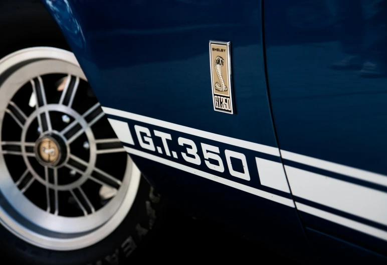 closeup of the wheels and badge on a racing car