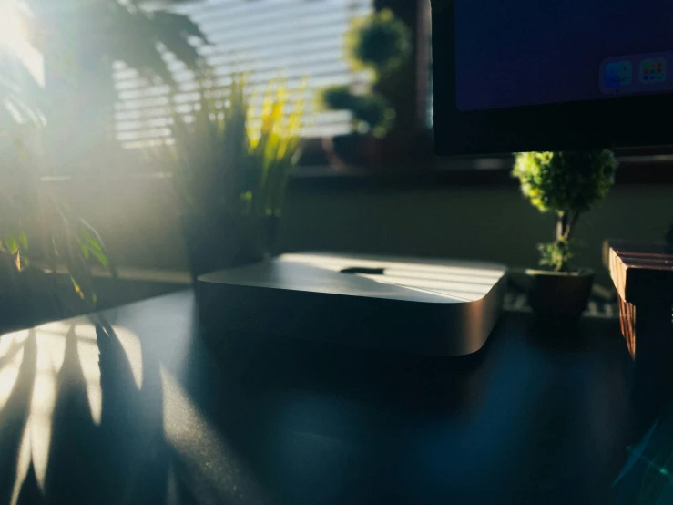 a desktop computer monitor is on a dark desk