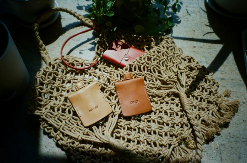 the purse has been placed on a jute bag