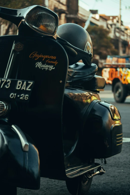 three motor scooters traveling down a city street