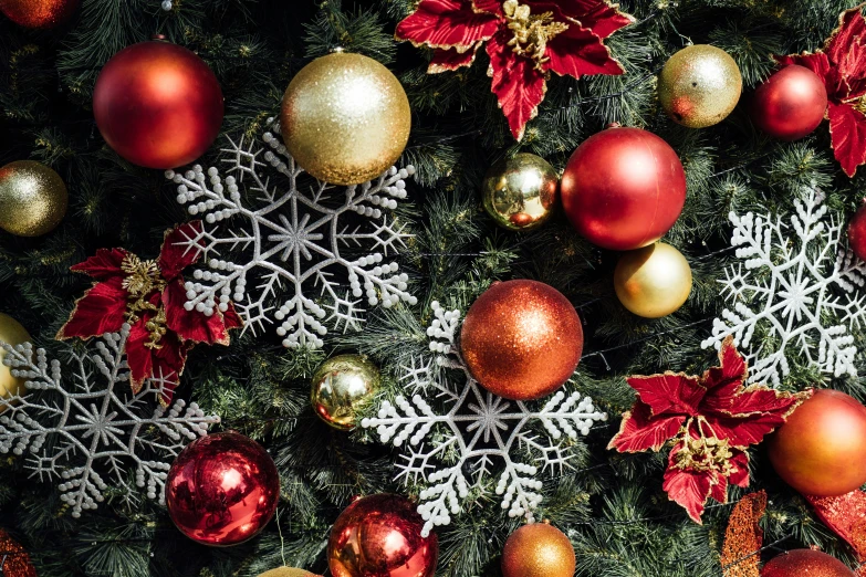 a large arrangement of ornaments on a christmas tree