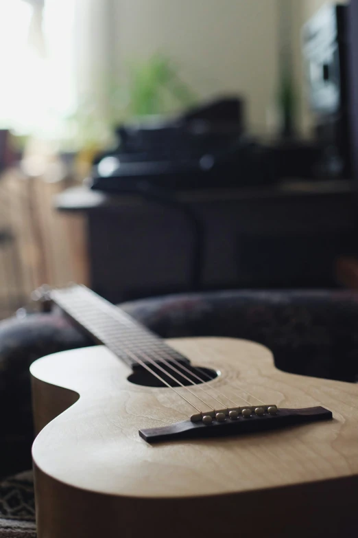 a guitar is laying down in a room