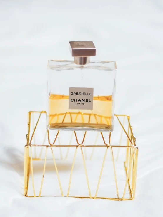 a chanel bottle sitting on a small holder