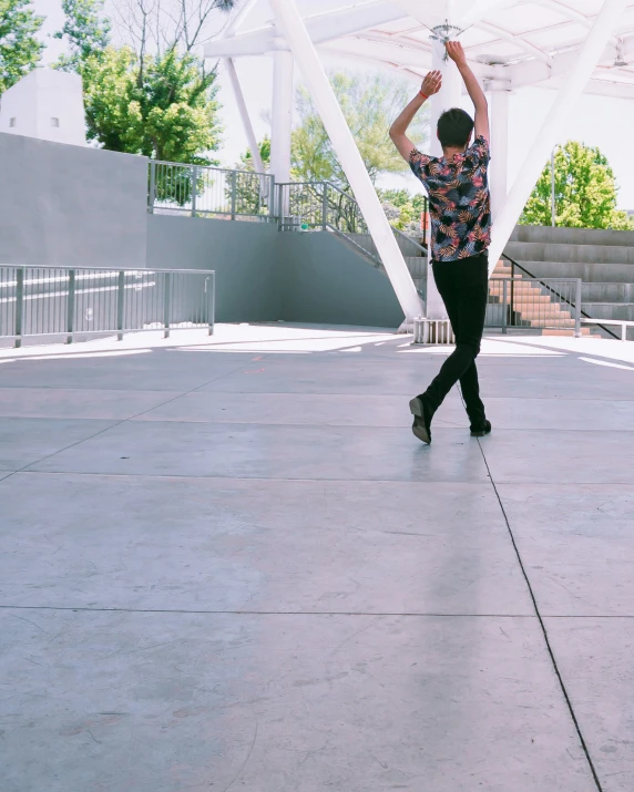 a person that is holding a frisbee in the air