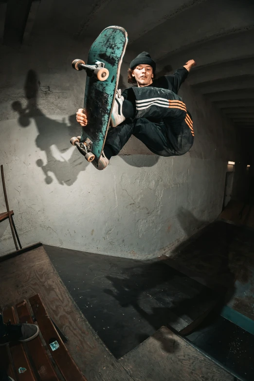 a person jumping into the air on top of a skateboard