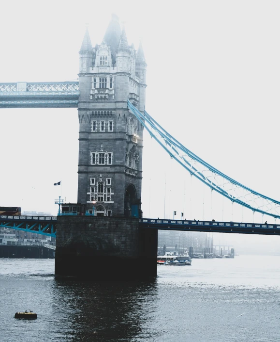 the tower bridge has been built over the water