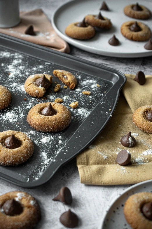 freshly made chocolate chip cookies sitting on plates