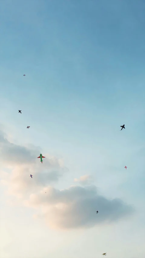 a sky filled with a bunch of kites flying through the air