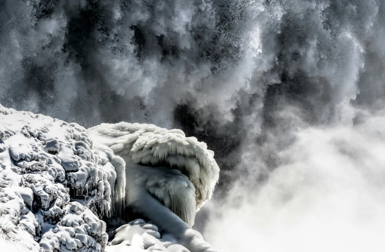 the mountain side shows the formation of clouds and ice