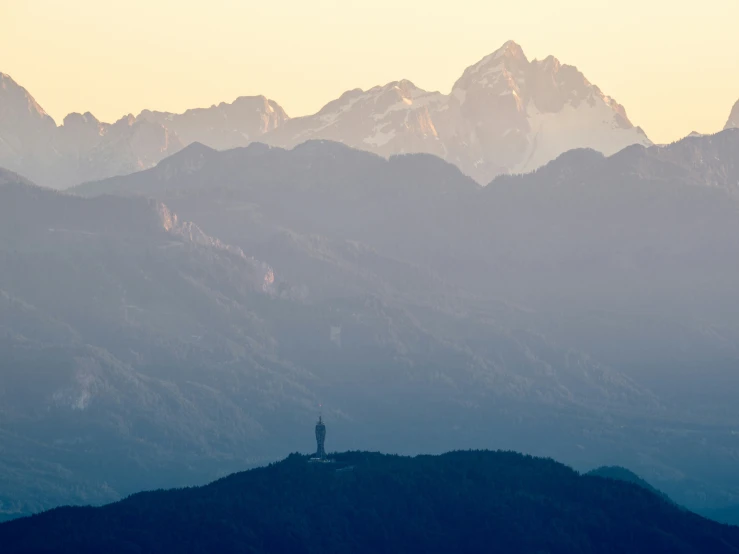 a couple of mountains with a sky background