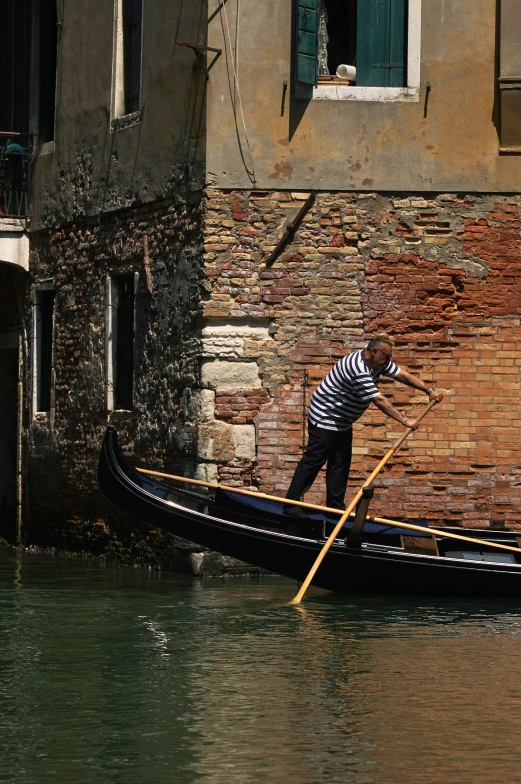 there is a man riding a boat on the water