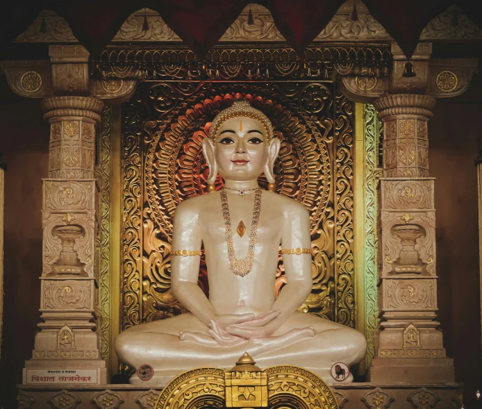 an image of buddha statue in front of an ornate structure