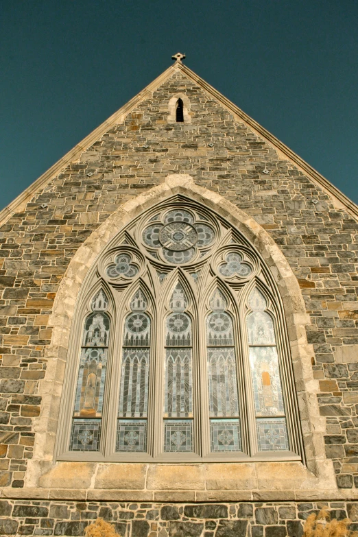 a very tall building with a massive window